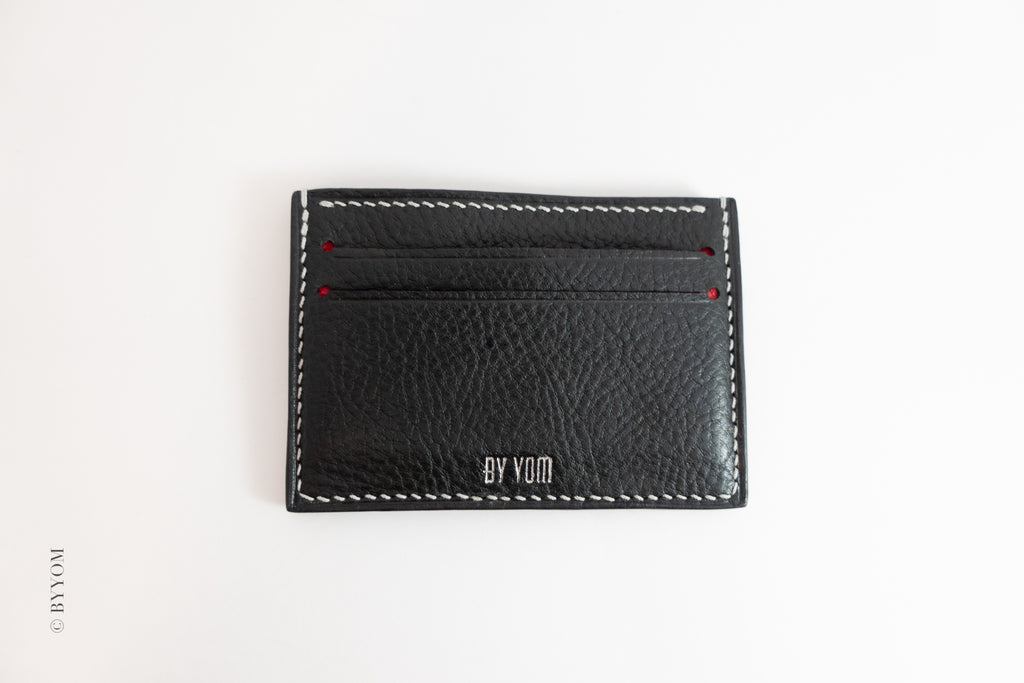 Alan goat skin cardholder with white stitch made 'BY VOM' branding on a white background